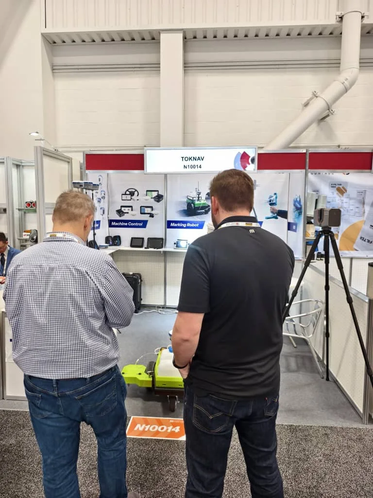 Visitors watching TOKNAV robot demonstration in Las Vegas